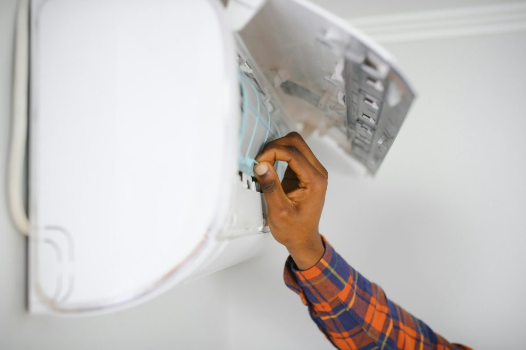 AC Electrician Technician Repairing Air Conditioner Appliance